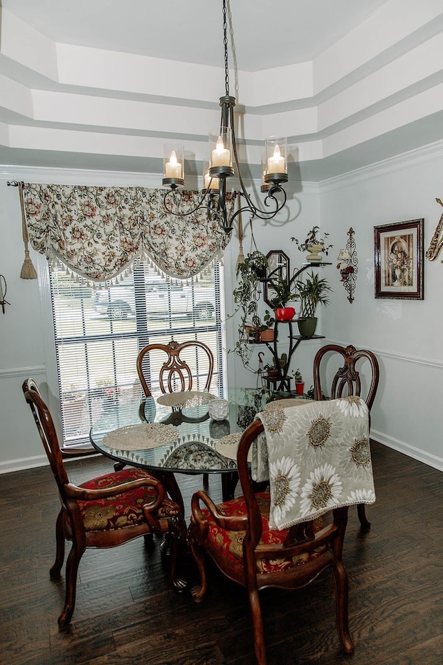  - dining area with a chandelier and wood finished floors