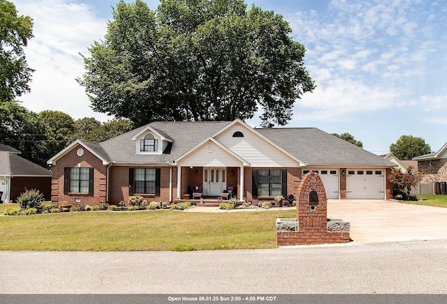  - view of front of home with brick siding, an attached garage, driveway, a front yard, and roof with shingles