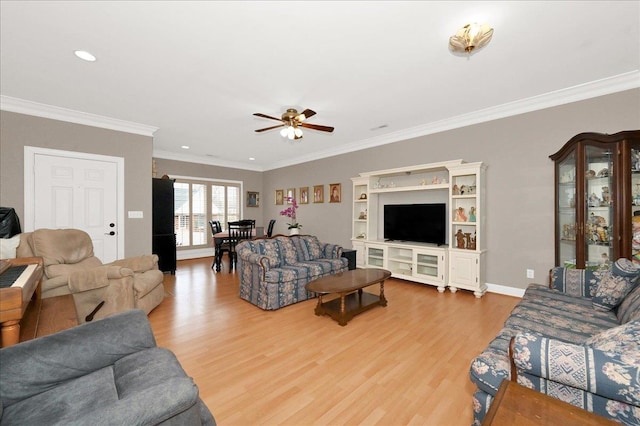  - living room with hardwood / wood-style floors, crown molding, and ceiling fan
