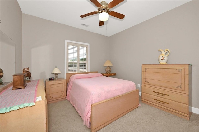  - bedroom with light colored carpet and ceiling fan