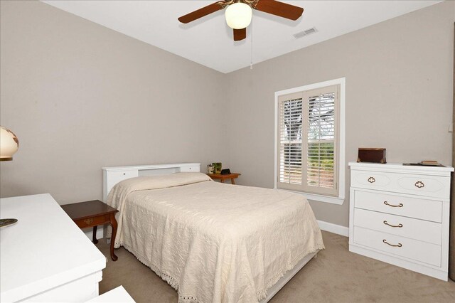  - bedroom with light carpet and ceiling fan
