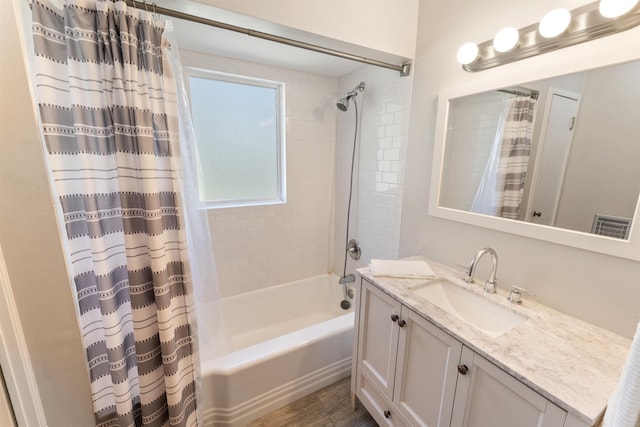 bathroom featuring vanity and shower / bath combination with curtain