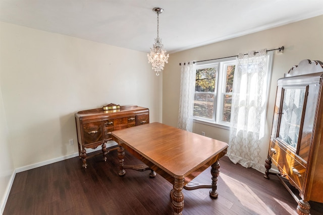 office area featuring dark hardwood / wood-style floors and a notable chandelier