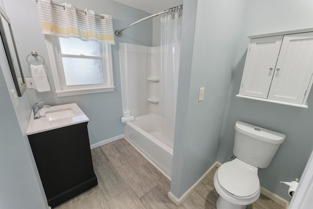 full bathroom featuring shower / bath combo, vanity, and toilet