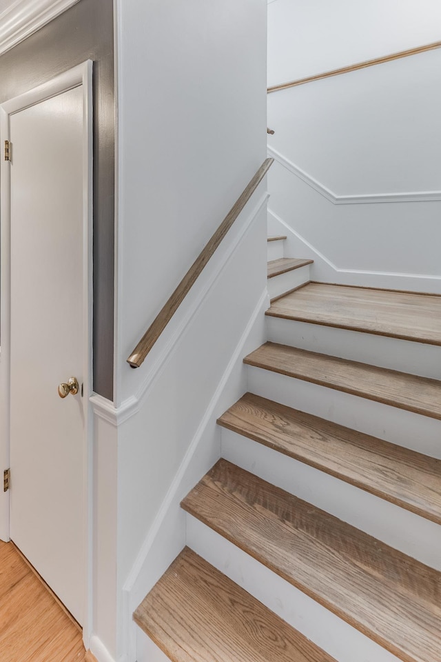 stairway with wood finished floors