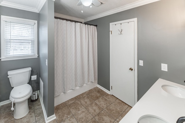 full bathroom featuring toilet, ornamental molding, a sink, and shower / bath combo with shower curtain