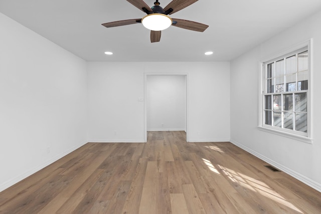 unfurnished room featuring ceiling fan and light hardwood / wood-style flooring