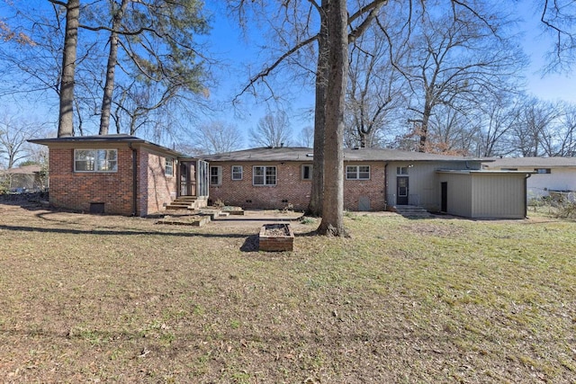 back of house featuring a lawn and a patio area