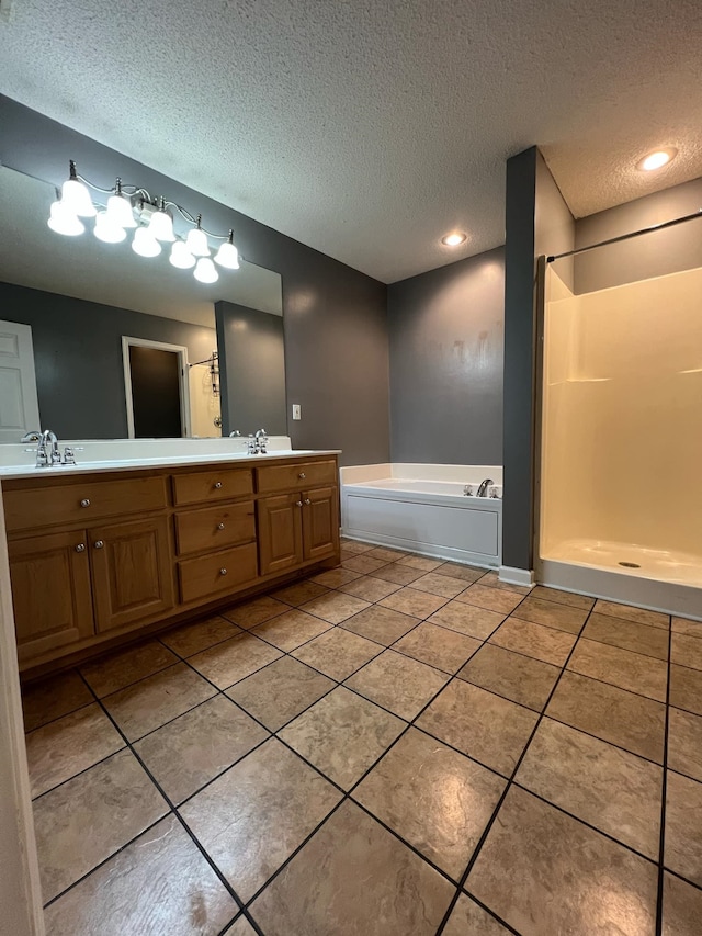 bathroom featuring vanity, tile patterned floors, a textured ceiling, and plus walk in shower