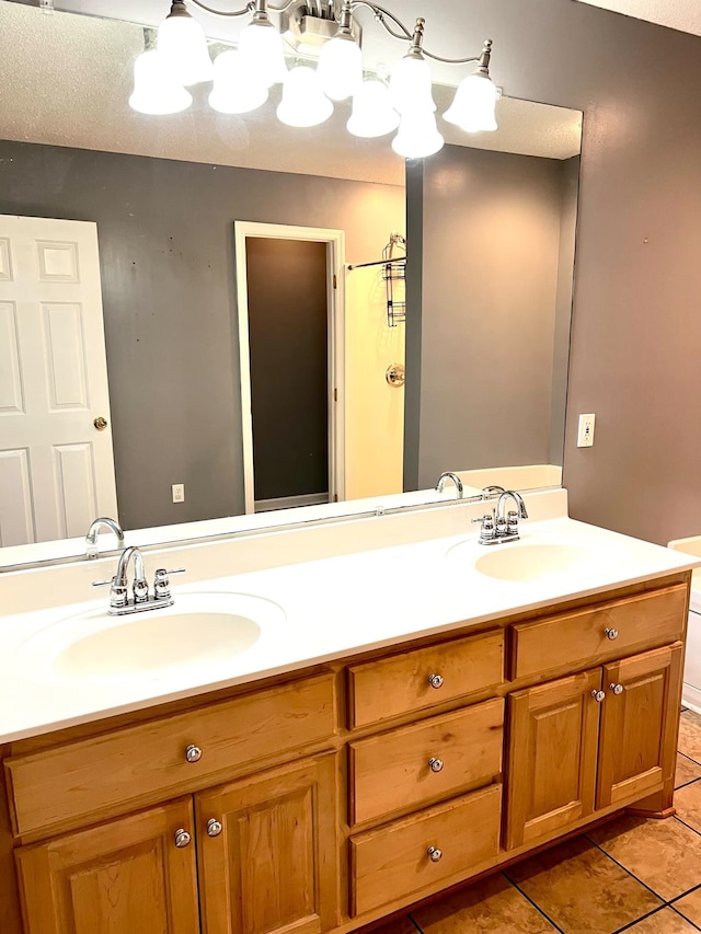 bathroom with vanity and tile patterned flooring