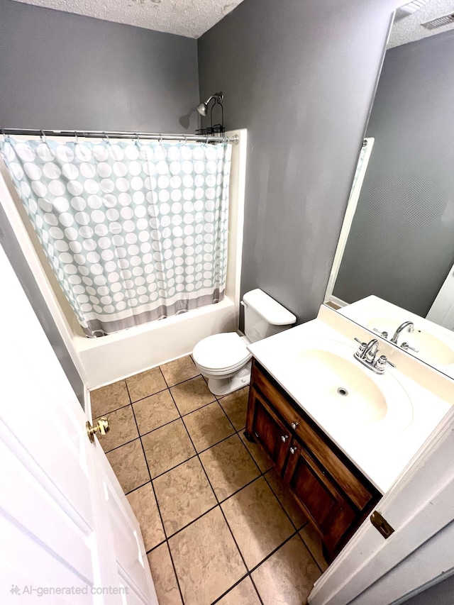 full bathroom featuring vanity, toilet, tile patterned floors, a textured ceiling, and shower / bath combo with shower curtain