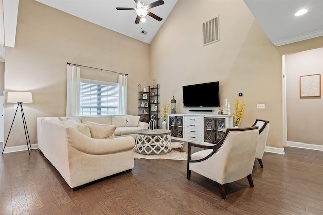 living room with dark wood-style floors, high vaulted ceiling, visible vents, and baseboards