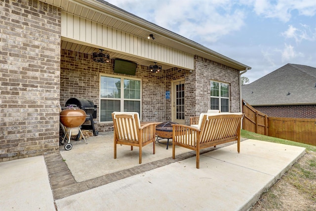 view of patio / terrace with a ceiling fan, outdoor lounge area, fence, and area for grilling