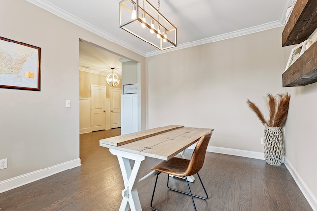 dining area featuring a chandelier, ornamental molding, dark wood-type flooring, and baseboards