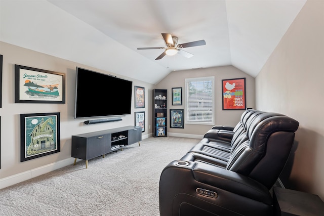 living area with light carpet, ceiling fan, baseboards, and lofted ceiling