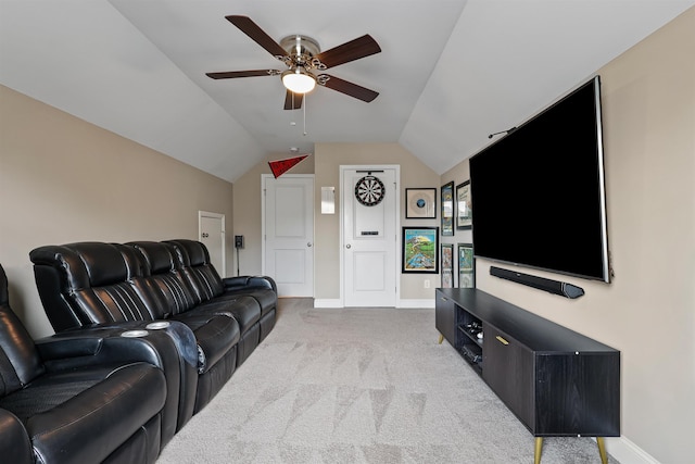 living area featuring carpet floors, ceiling fan, baseboards, and lofted ceiling