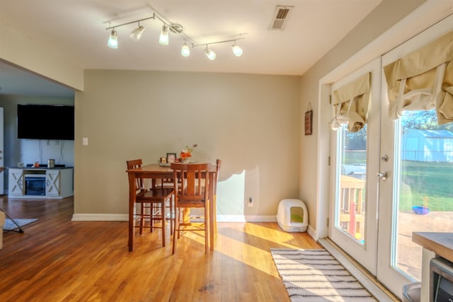 dining area with hardwood / wood-style floors