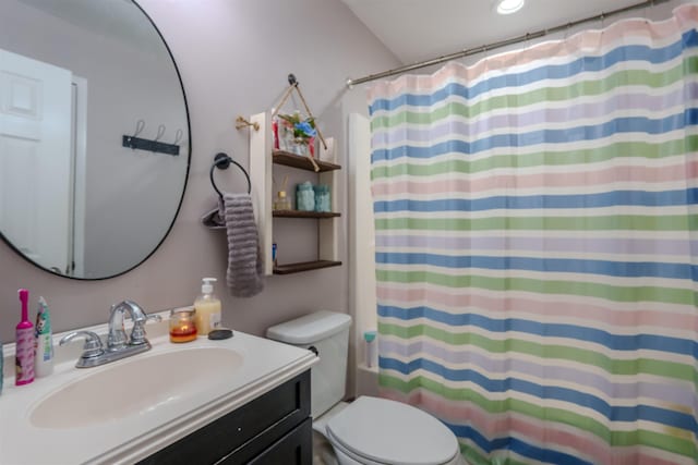 full bathroom featuring vanity, toilet, and shower / tub combo