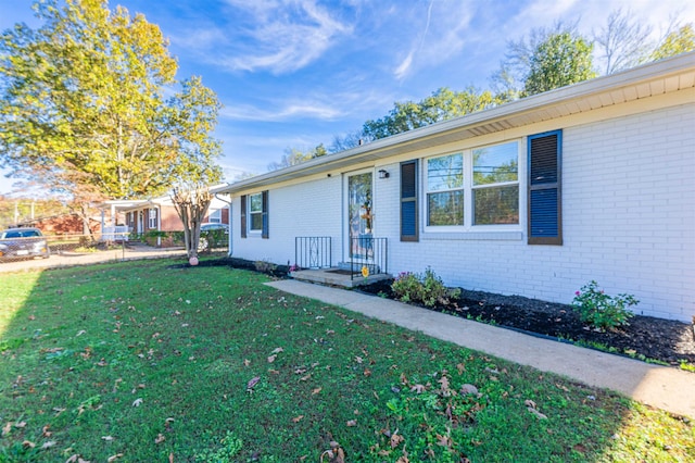 ranch-style home with a front yard