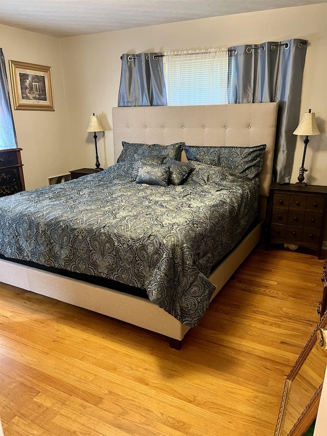 bedroom featuring hardwood / wood-style floors