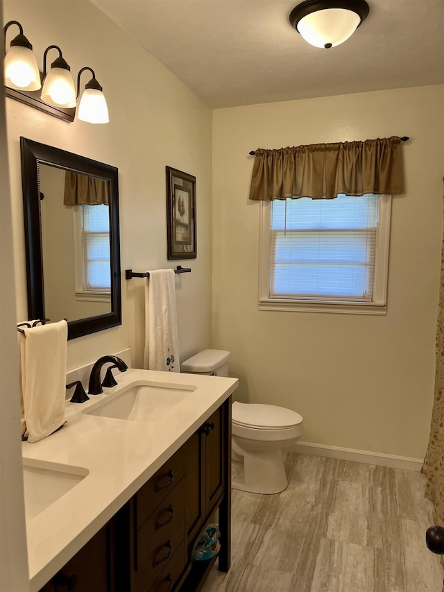 bathroom with vanity and toilet