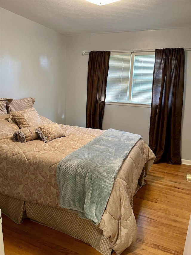 bedroom featuring light hardwood / wood-style flooring