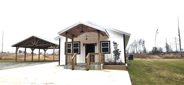 view of outbuilding with a carport and central AC unit