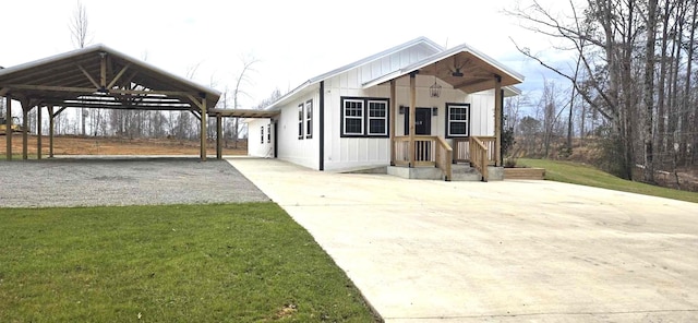 exterior space with driveway and an attached carport