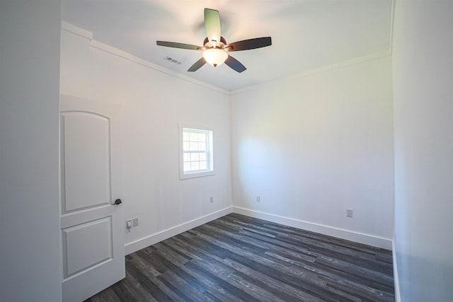 spare room featuring a ceiling fan, baseboards, visible vents, and dark wood-type flooring