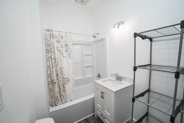 full bathroom with ornamental molding, shower / tub combo, visible vents, and vanity