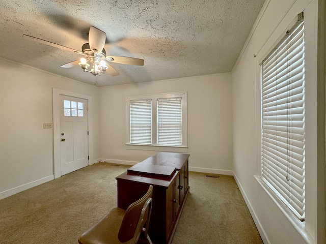 carpeted entrance foyer featuring ceiling fan and a textured ceiling