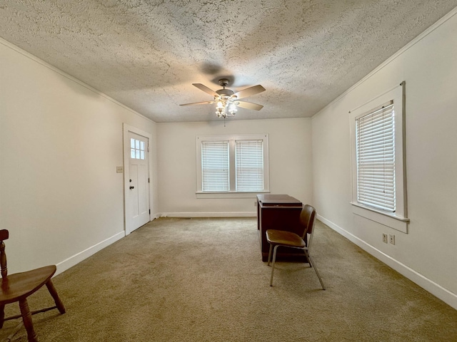 unfurnished room featuring crown molding, ceiling fan, carpet flooring, and a textured ceiling