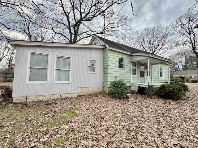 view of property exterior with covered porch