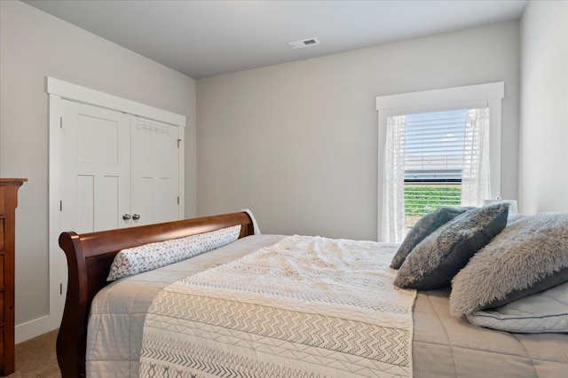 bedroom with carpet flooring and a closet