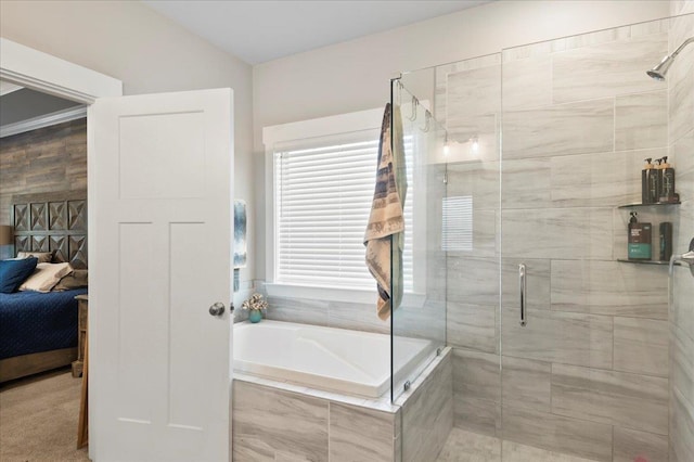 bathroom with shower with separate bathtub