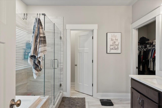 bathroom with plus walk in shower and vanity