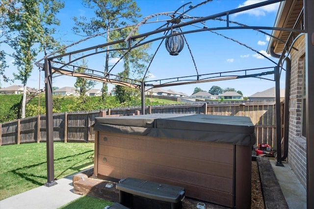 view of patio / terrace with a hot tub