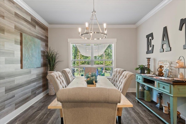 dining room with a chandelier, wooden walls, dark hardwood / wood-style floors, and ornamental molding