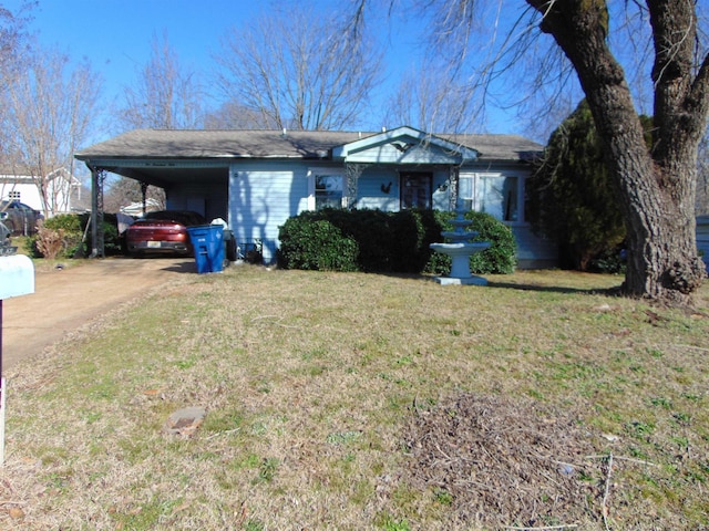 single story home with a front lawn and a carport