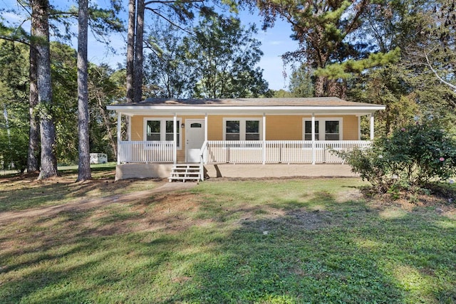 ranch-style home with a porch and a front lawn