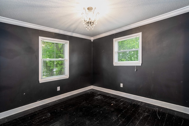  - unfurnished room with a chandelier, baseboards, healthy amount of natural light, ornamental molding, and a textured ceiling