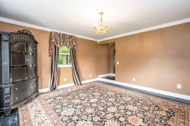  - carpeted empty room featuring a chandelier, ornamental molding, and baseboards