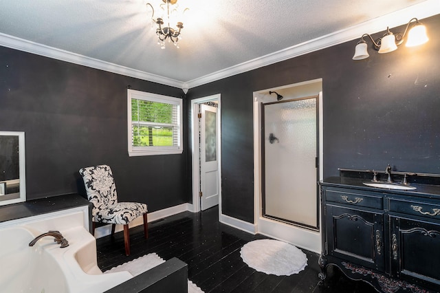  - full bath featuring a stall shower, hardwood / wood-style flooring, ornamental molding, a bath, and baseboards