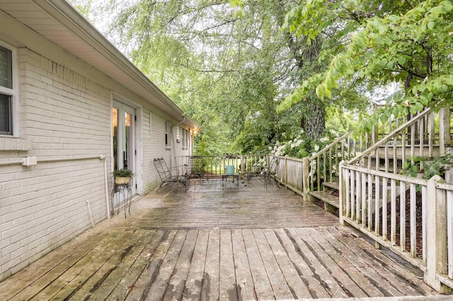  - deck with stairs and view of scattered trees
