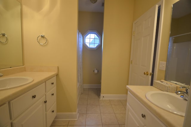 bathroom featuring tile patterned flooring and vanity