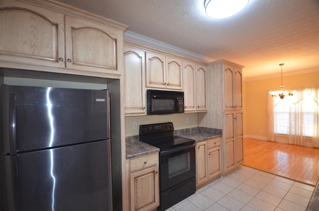 kitchen with hanging light fixtures, ornamental molding, light brown cabinets, and black appliances