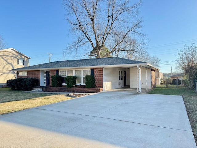 ranch-style house with a carport and a front yard