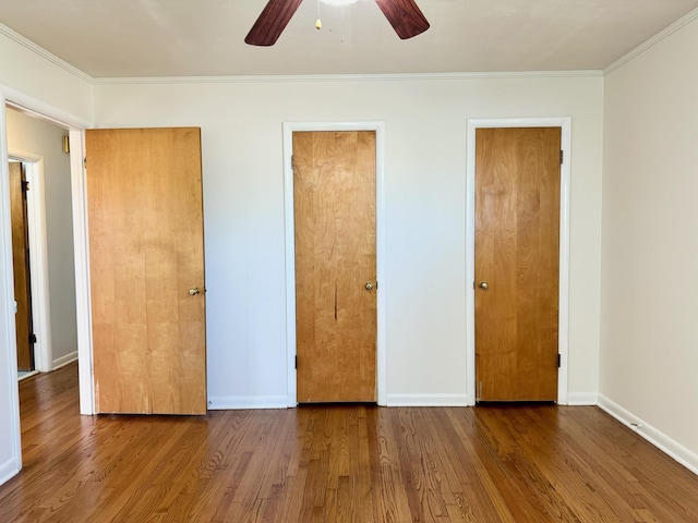 unfurnished bedroom with hardwood / wood-style floors, crown molding, and ceiling fan