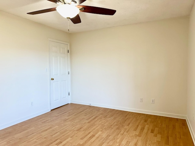 unfurnished room with ceiling fan and light hardwood / wood-style flooring