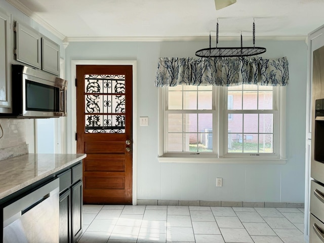 kitchen with stainless steel appliances, crown molding, gray cabinets, and light tile patterned floors